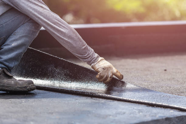 Professional Basement Waterproofing technician working in Oakland, IA
